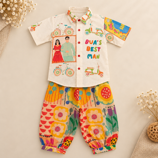A two-piece baby boy's outfit set featuring a cream-colored short-sleeve shirt with colorful retro graphics, a photo of a couple, and the text 'BVA'S BEST MAN', paired with matching colorful patterned pants, laid flat on a beige background with decorative dried flowers.